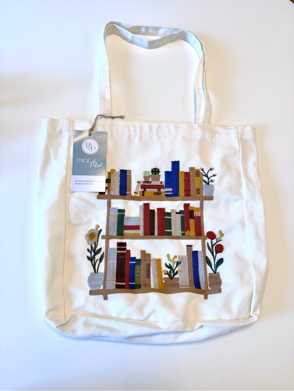 Page & Petal reusable embroidered canvas tote bag with a bookshelf design
